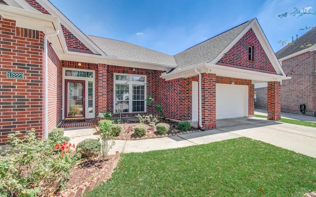 12223 Ayrshire Pl, Houston, TX 77089 - view of front of home with brick siding, driveway, a shingled roof, and a garage