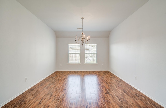 12223 Ayrshire Pl, Houston, TX 77089 - spare room with a chandelier, dark wood finished floors, and baseboards