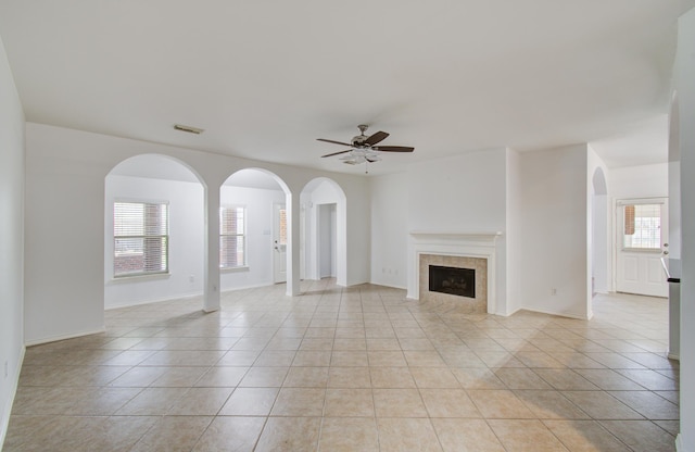 12223 Ayrshire Pl, Houston, TX 77089 - unfurnished living room with healthy amount of natural light, a ceiling fan, and light tile patterned floors