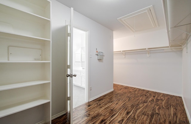 12223 Ayrshire Pl, Houston, TX 77089 - spacious closet featuring attic access and wood finished floors