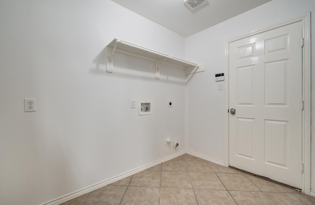 12223 Ayrshire Pl, Houston, TX 77089 - laundry room featuring washer hookup, light tile patterned floors, hookup for a gas dryer, hookup for an electric dryer, and baseboards