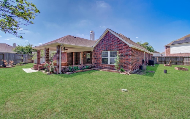 12223 Ayrshire Pl, Houston, TX 77089 - rear view of property featuring a ceiling fan, brick siding, central AC unit, and a chimney
