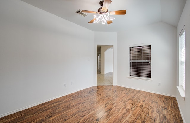 12223 Ayrshire Pl, Houston, TX 77089 - empty room featuring wood finished floors, ceiling fan, lofted ceiling, and baseboards