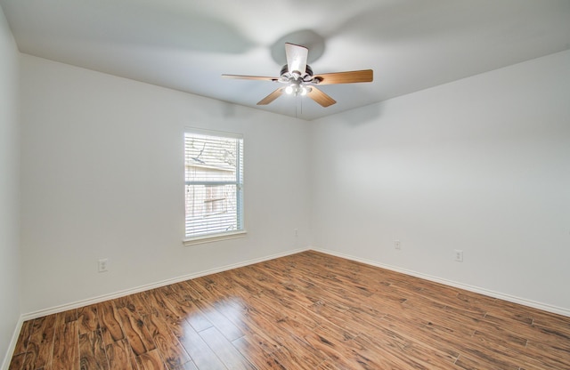 12223 Ayrshire Pl, Houston, TX 77089 - empty room featuring a ceiling fan, wood finished floors, and baseboards