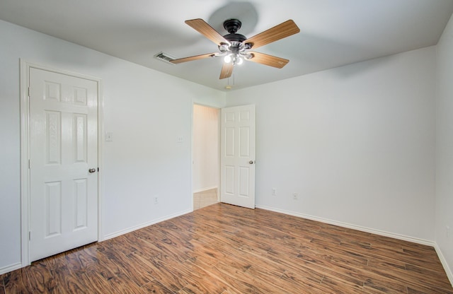 12223 Ayrshire Pl, Houston, TX 77089 - empty room featuring ceiling fan, wood finished floors, and baseboards