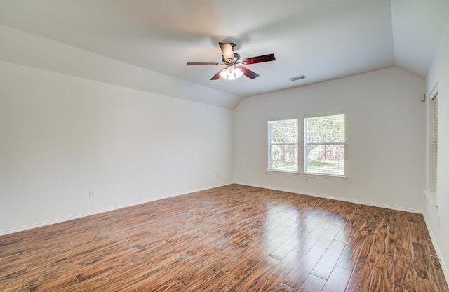 12223 Ayrshire Pl, Houston, TX 77089 - empty room featuring vaulted ceiling, ceiling fan, wood finished floors, and baseboards