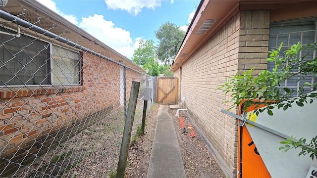 3823 Regency Dr, Houston, TX 77045 - view of side of property featuring brick siding