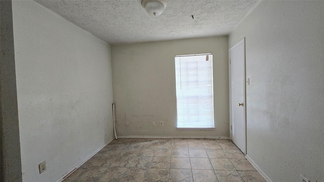 3823 Regency Dr, Houston, TX 77045 - unfurnished room featuring a textured ceiling and baseboards