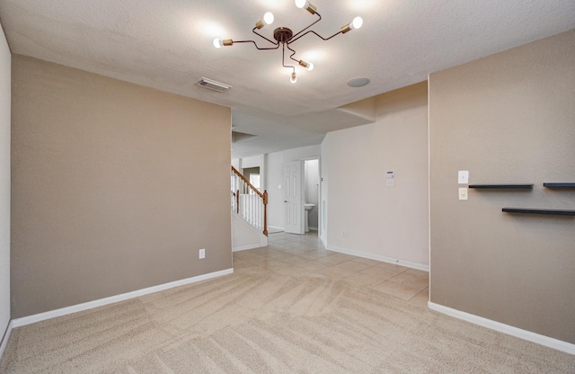 17919 Royal Gate Ln, Richmond, TX 77407 - unfurnished room with stairway, carpet, baseboards, and a textured ceiling