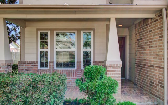 17919 Royal Gate Ln, Richmond, TX 77407 - view of exterior entry featuring brick siding and a porch