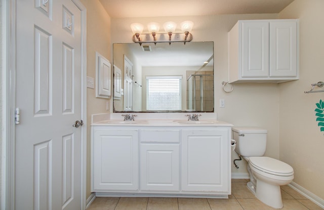 17919 Royal Gate Ln, Richmond, TX 77407 - full bathroom featuring a shower with door, toilet, tile patterned floors, double vanity, and baseboards