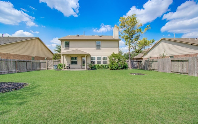17919 Royal Gate Ln, Richmond, TX 77407 - back of property featuring a chimney and a patio