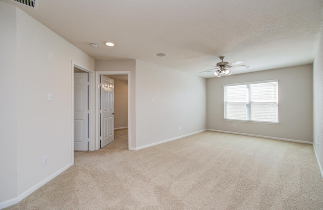 17919 Royal Gate Ln, Richmond, TX 77407 - unfurnished room featuring light carpet, baseboards, a ceiling fan, and recessed lighting