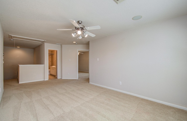 17919 Royal Gate Ln, Richmond, TX 77407 - empty room with attic access, light colored carpet, a ceiling fan, and baseboards