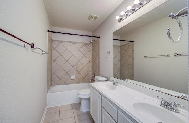 17919 Royal Gate Ln, Richmond, TX 77407 - bathroom with double vanity, tile patterned floors, bathtub / shower combination, toilet, and a textured ceiling
