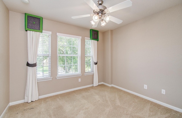 17919 Royal Gate Ln, Richmond, TX 77407 - spare room with light colored carpet, healthy amount of natural light, and a ceiling fan