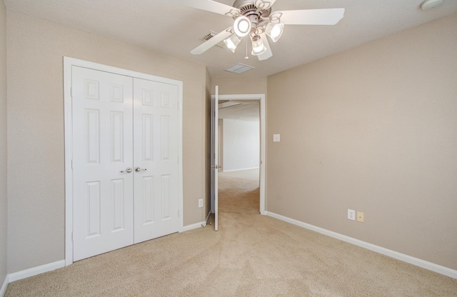 17919 Royal Gate Ln, Richmond, TX 77407 - unfurnished bedroom with light carpet, a closet, baseboards, and ceiling fan