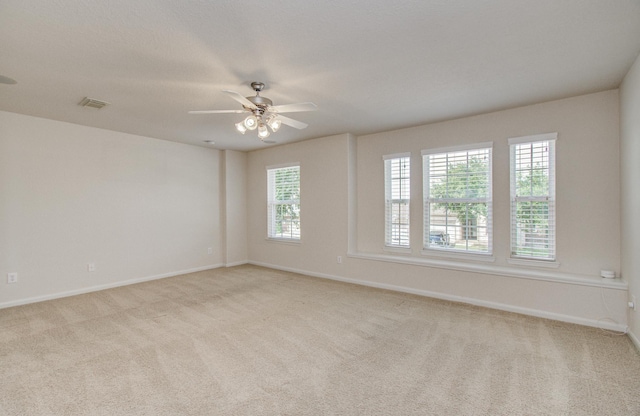 17919 Royal Gate Ln, Richmond, TX 77407 - spare room featuring baseboards, carpet floors, and a ceiling fan