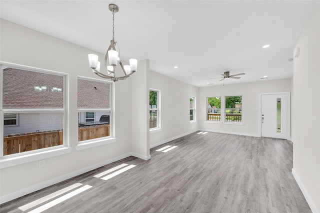 8022 Yoe St, Houston, TX 77078 - unfurnished living room with a chandelier, wood finished floors, baseboards, recessed lighting, and a ceiling fan