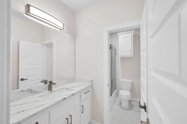 8022 Yoe St, Houston, TX 77078 - full bathroom with toilet, vanity, marble look tile flooring, baseboards, and bath / shower combo with glass door