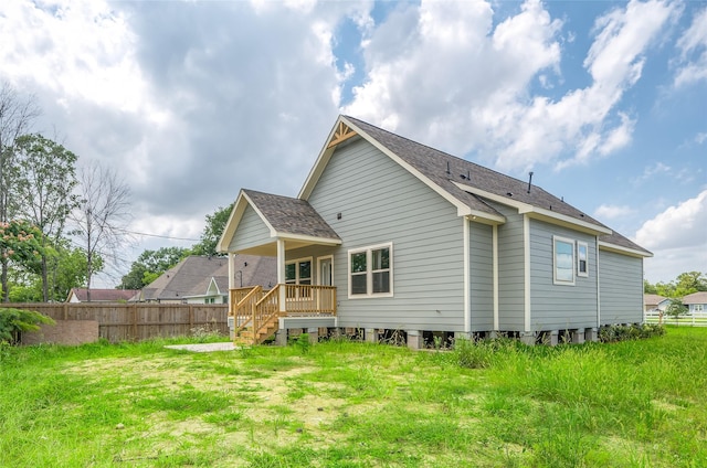 8022 Yoe St, Houston, TX 77078 - back of property featuring a shingled roof
