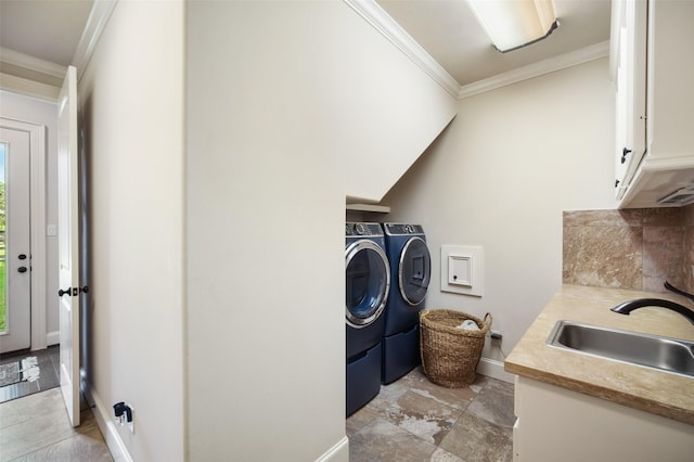 9 Copper Bottom Dr, Tomball, TX 77377 - washroom with separate washer and dryer, ornamental molding, cabinet space, and baseboards