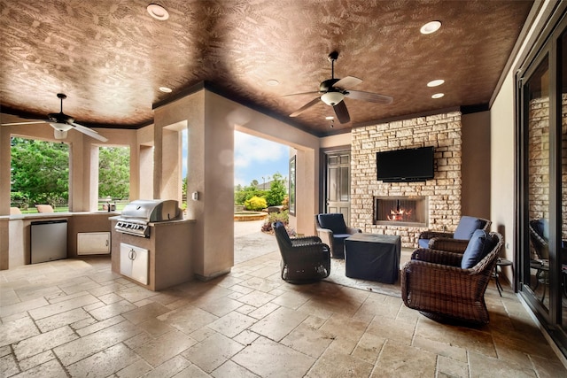 9 Copper Bottom Dr, Tomball, TX 77377 - view of patio / terrace with a ceiling fan and an outdoor living space with a fireplace
