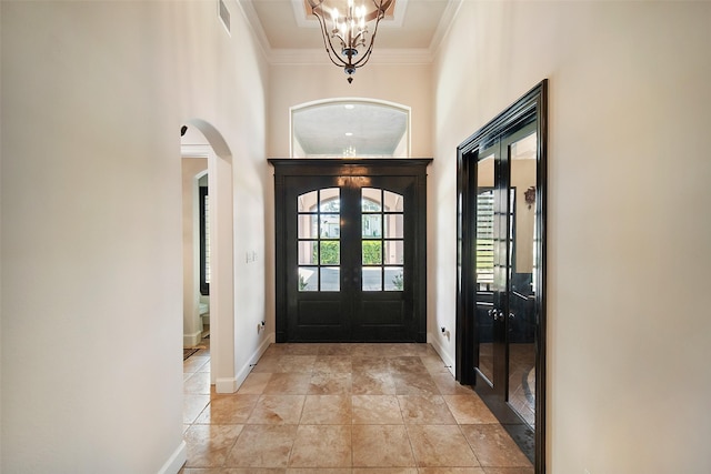9 Copper Bottom Dr, Tomball, TX 77377 - entrance foyer with arched walkways, french doors, ornamental molding, baseboards, and a high ceiling