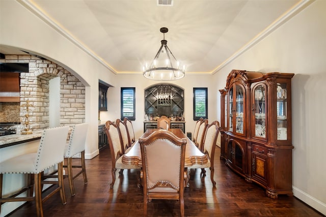 9 Copper Bottom Dr, Tomball, TX 77377 - dining room with a chandelier, dark wood finished floors, crown molding, and baseboards