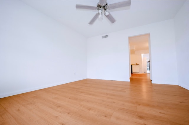 12048 Beechnut St, Houston, TX 77072 - empty room with light wood-style floors and a ceiling fan