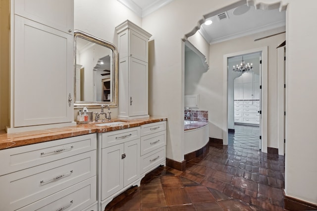 1915 Kirby Dr, Houston, TX 77019 - full bath featuring crown molding, vanity, baseboards, a chandelier, and a tub to relax in