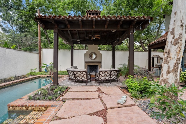 1915 Kirby Dr, Houston, TX 77019 - fenced backyard with ceiling fan, a patio, an outdoor pool, an outdoor living space with a fireplace, and a gazebo