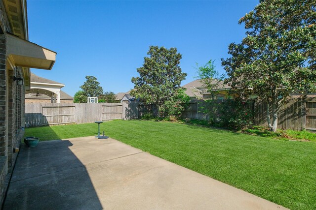 17414 Sandalisle Ln, Richmond, TX 77407 - view of yard featuring a patio