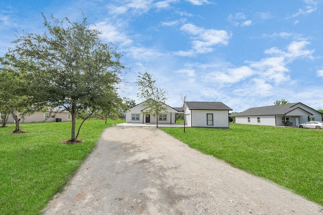 5046 Muske Ln, Brookshire, TX 77423 - view of front of house with driveway and a front lawn