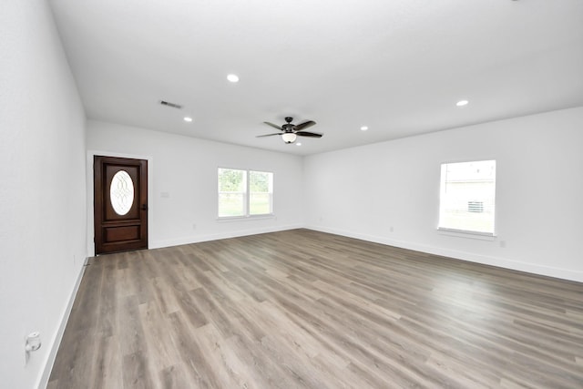 5046 Muske Ln, Brookshire, TX 77423 - unfurnished living room featuring wood finished floors, recessed lighting, baseboards, and a ceiling fan