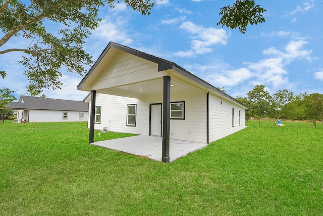 5046 Muske Ln, Brookshire, TX 77423 - rear view of house with a patio and a lawn