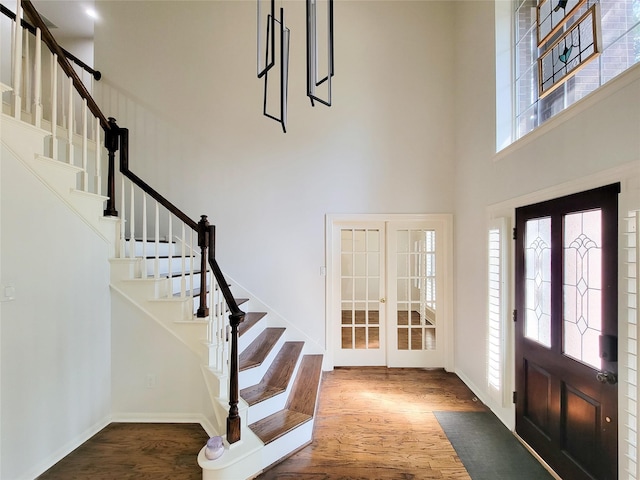 2927 Cambry Crossing Ct, Katy, TX 77494 - entryway featuring french doors, healthy amount of natural light, a towering ceiling, and wood finished floors