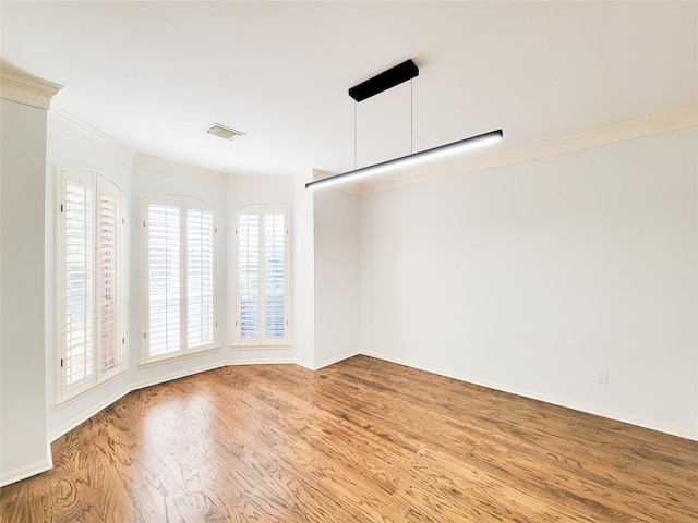 2927 Cambry Crossing Ct, Katy, TX 77494 - spare room with crown molding, wood finished floors, and baseboards