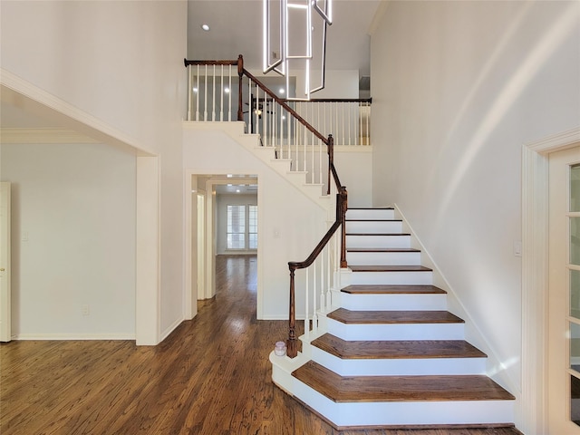 2927 Cambry Crossing Ct, Katy, TX 77494 - stairs with a high ceiling, wood finished floors, and baseboards