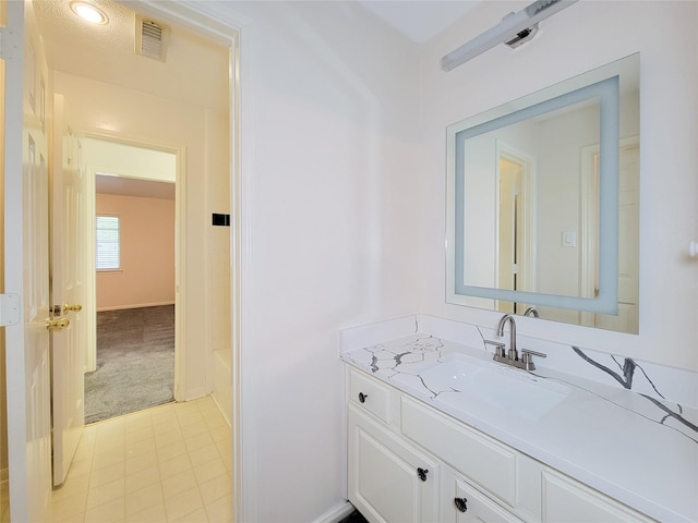 2927 Cambry Crossing Ct, Katy, TX 77494 - bathroom with vanity, a tub to relax in, and baseboards