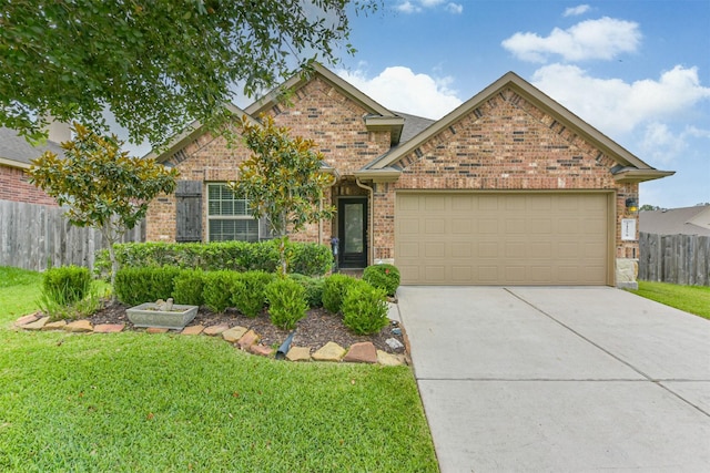 21579 Spear Valley Ln, Porter, TX 77365 - traditional-style home with brick siding, an attached garage, and driveway