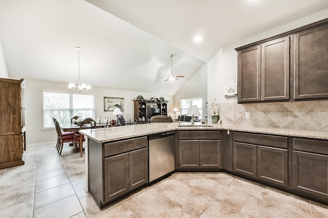 21579 Spear Valley Ln, Porter, TX 77365 - kitchen with stainless steel dishwasher, dark brown cabinets, a peninsula, a chandelier, and light stone countertops