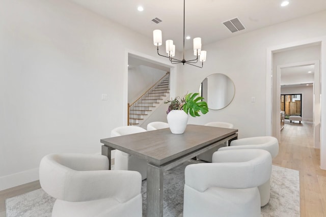 1526 Wakefield Dr, Houston, TX 77018 - dining area with a chandelier, light wood-type flooring, stairway, recessed lighting, and baseboards