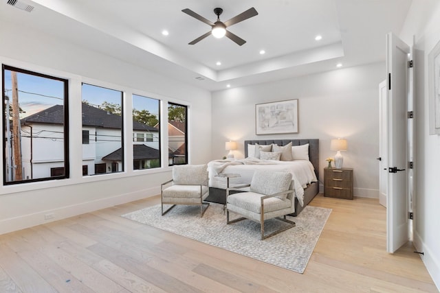 1526 Wakefield Dr, Houston, TX 77018 - bedroom with light wood-style floors, recessed lighting, baseboards, a raised ceiling, and ceiling fan