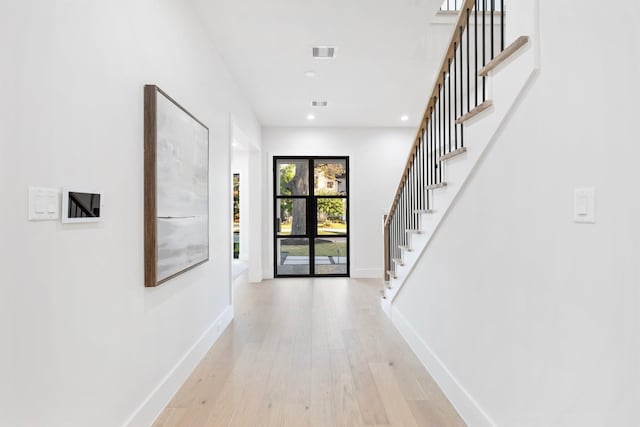 1526 Wakefield Dr, Houston, TX 77018 - entryway featuring baseboards, stairs, light wood-type flooring, and recessed lighting