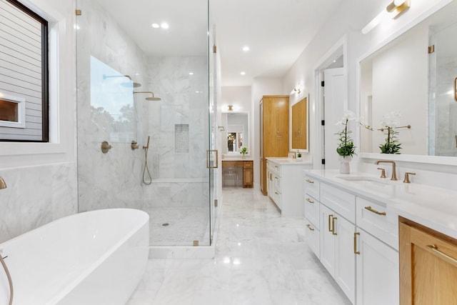 1526 Wakefield Dr, Houston, TX 77018 - full bath featuring marble tiled flooring, a marble finish shower, a soaking tub, two vanities, and recessed lighting