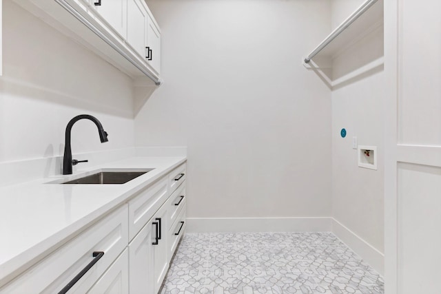 1526 Wakefield Dr, Houston, TX 77018 - laundry room featuring washer hookup, baseboards, and cabinet space