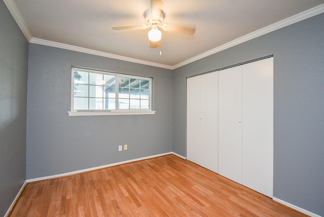 1102 Ashdale Dr, Sugar Land, TX 77498 - unfurnished bedroom with wood finished floors, crown molding, a closet, and baseboards