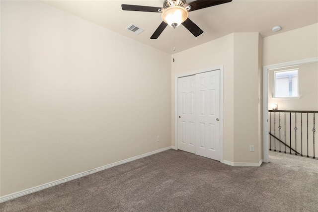 1511 Peyton Oaks Pl, Houston, TX 77043 - unfurnished bedroom featuring carpet flooring, a closet, baseboards, and ceiling fan