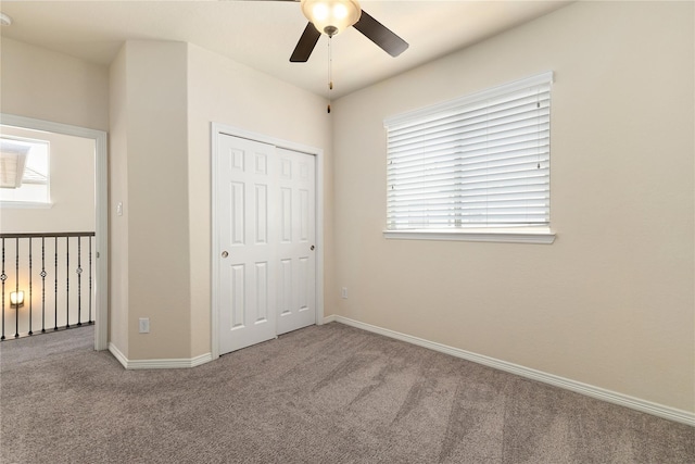 1511 Peyton Oaks Pl, Houston, TX 77043 - unfurnished bedroom featuring carpet flooring, a closet, and baseboards